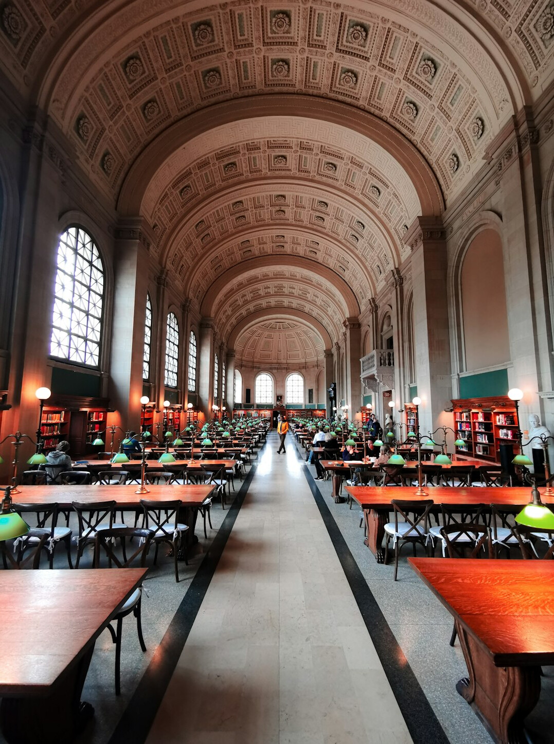 Quiet library interior with long reading tables