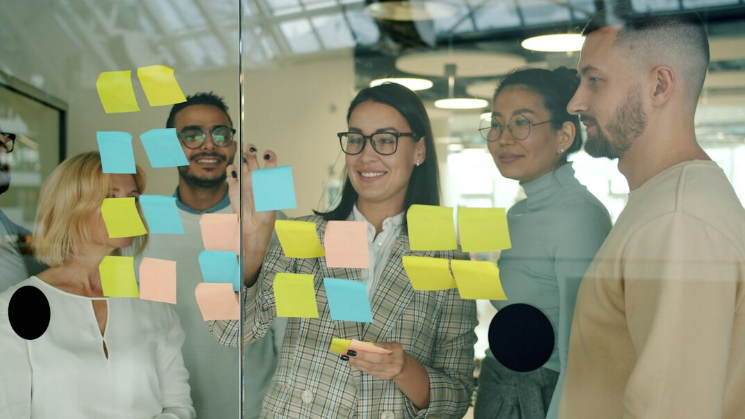 team brainstorming on whiteboard