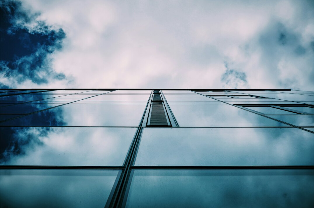 Glass facade architectural detail looking upward