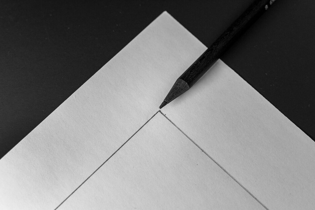 Pen resting on a paper document being reviewed